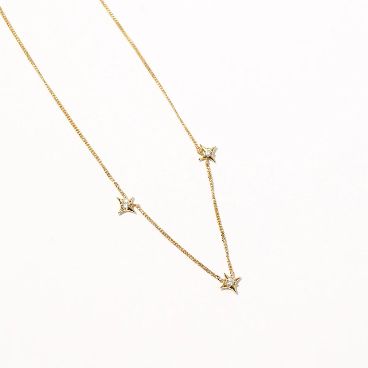 Cosmic Star Charm Necklace in Gold